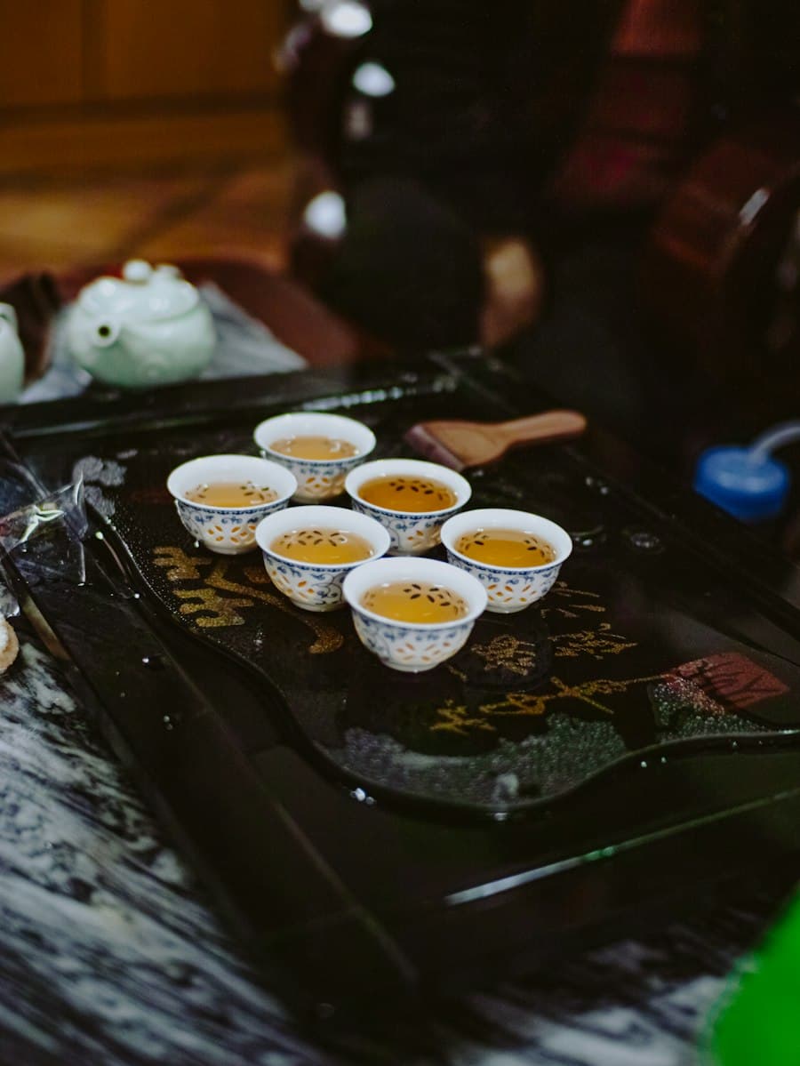 A full gongfu tea setting laid out in warm light